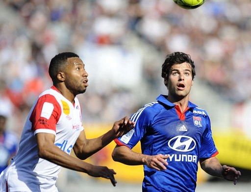 Nancy's Jordan Loties (L) fights for the ball with Lyon's Yoann Gourcuff at Marcel Picot Stadium, on May 5, 2013
